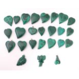 A quantity of malachite hardstone pendants formed as hearts etc. The largest approx 1 1/2" high