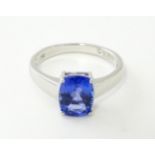 An 18ct white gold ring set with tanzanite. Ring size approx. N. Please Note - we do not make