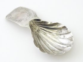 A Geo III silver caddy spoon with shell formed bowl, hallmarked London 1794, maker George Smith &