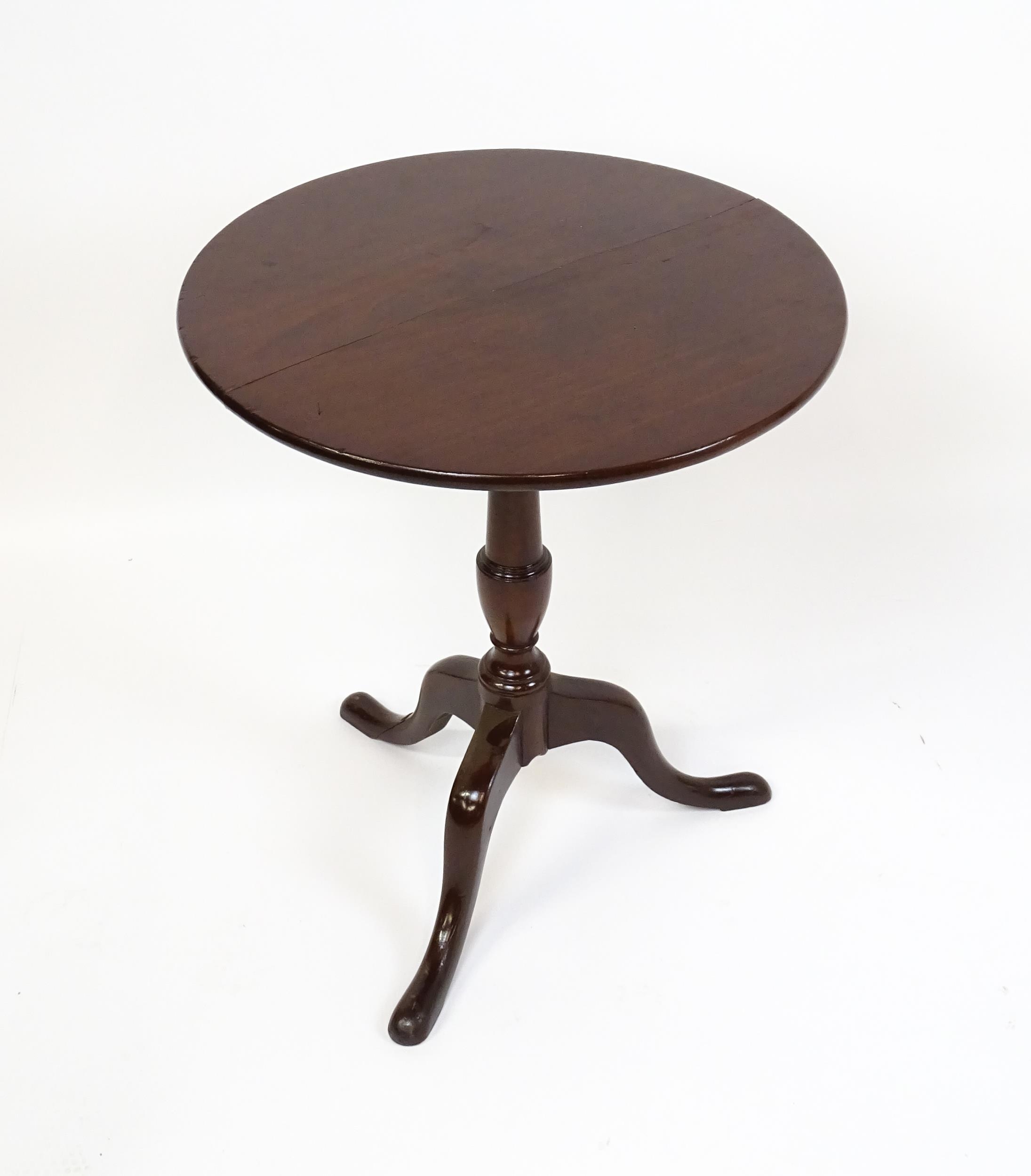 A 19thC mahogany tripod table with a turned pedestal above three cabriole legs. 27" high x 23" in - Image 5 of 5