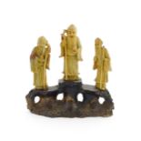 A Chinese carved soapstone figural group depicting three sage figures. Approx. 8 1/2" high Please