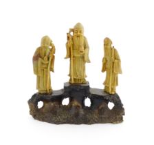 A Chinese carved soapstone figural group depicting three sage figures. Approx. 8 1/2" high Please