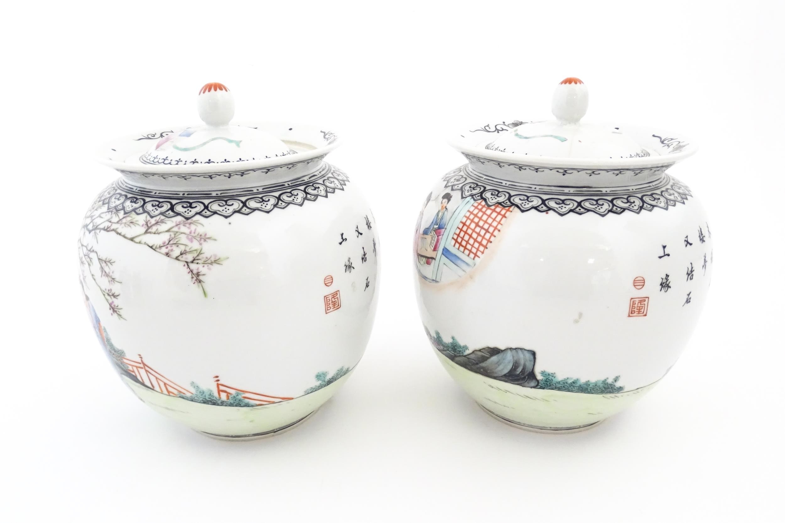 A pair of Chinese pot and cover vases decorated with ladies in a landscapes, and Character script. - Image 5 of 10