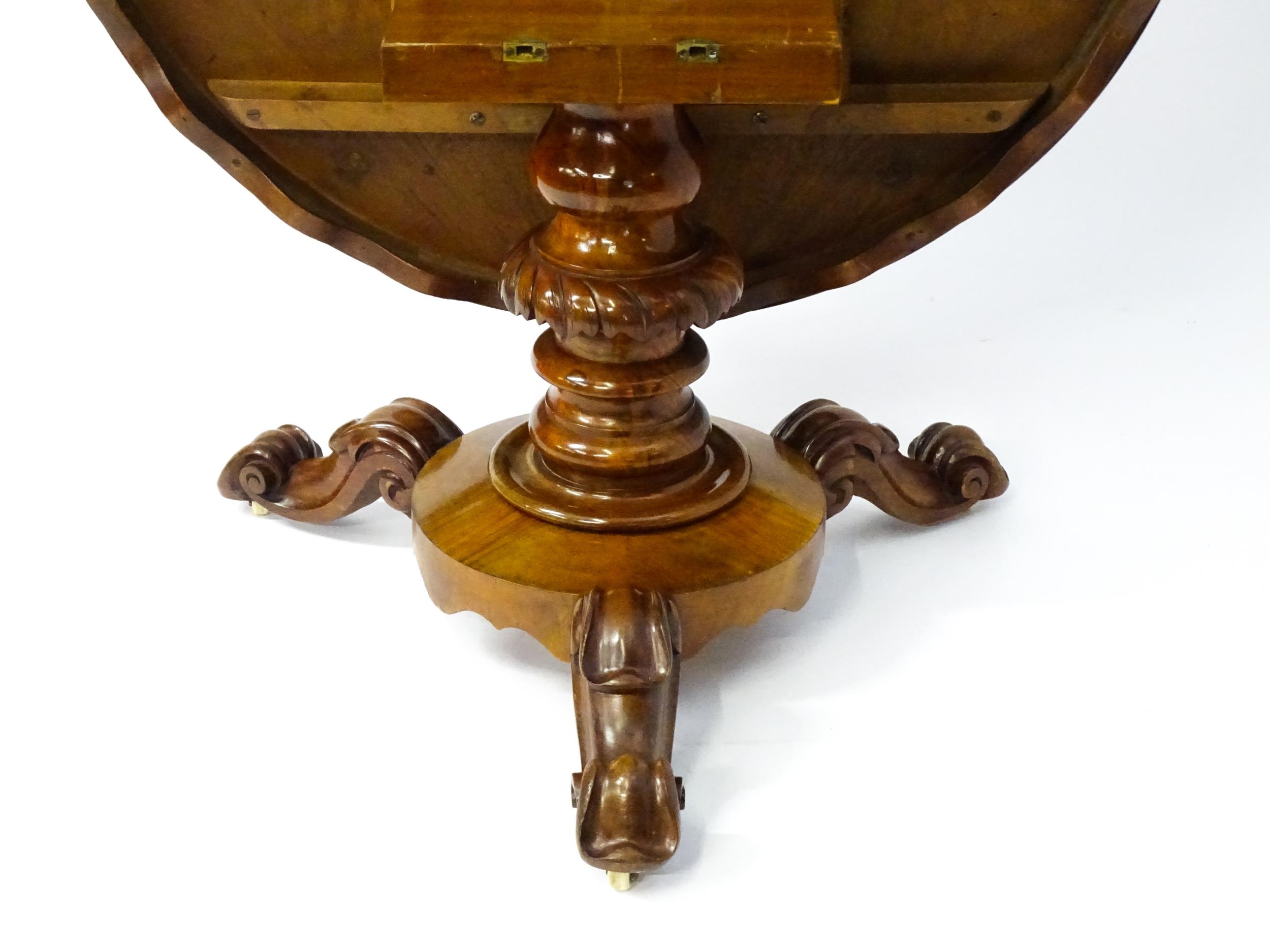 A 19thC mahogany tilt top breakfast table with a carved frieze above a turned and carved pedestal - Image 5 of 11