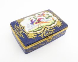 A French porcelain box of rectangular form the cobalt blue ground with gilt decoration, the lid with