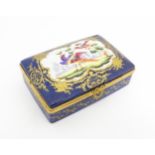 A French porcelain box of rectangular form the cobalt blue ground with gilt decoration, the lid with