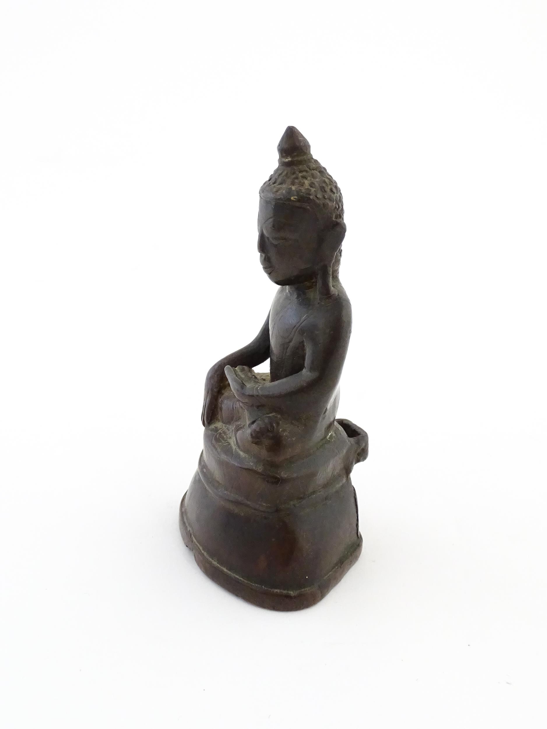 An Asian cast sculpture modelled as a seated Buddha. Approx. 5" high Please Note - we do not make - Image 3 of 6