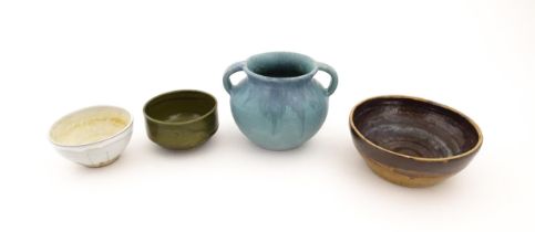 Four items of studio pottery to include an Upchurch twin handled pot, a small bowl by Geoffrey