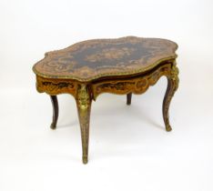 A 19thC kingwood centre table with a marquetry inlaid top having satinwood, mahogany, walnut and