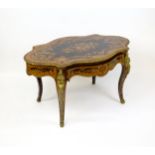 A 19thC kingwood centre table with a marquetry inlaid top having satinwood, mahogany, walnut and