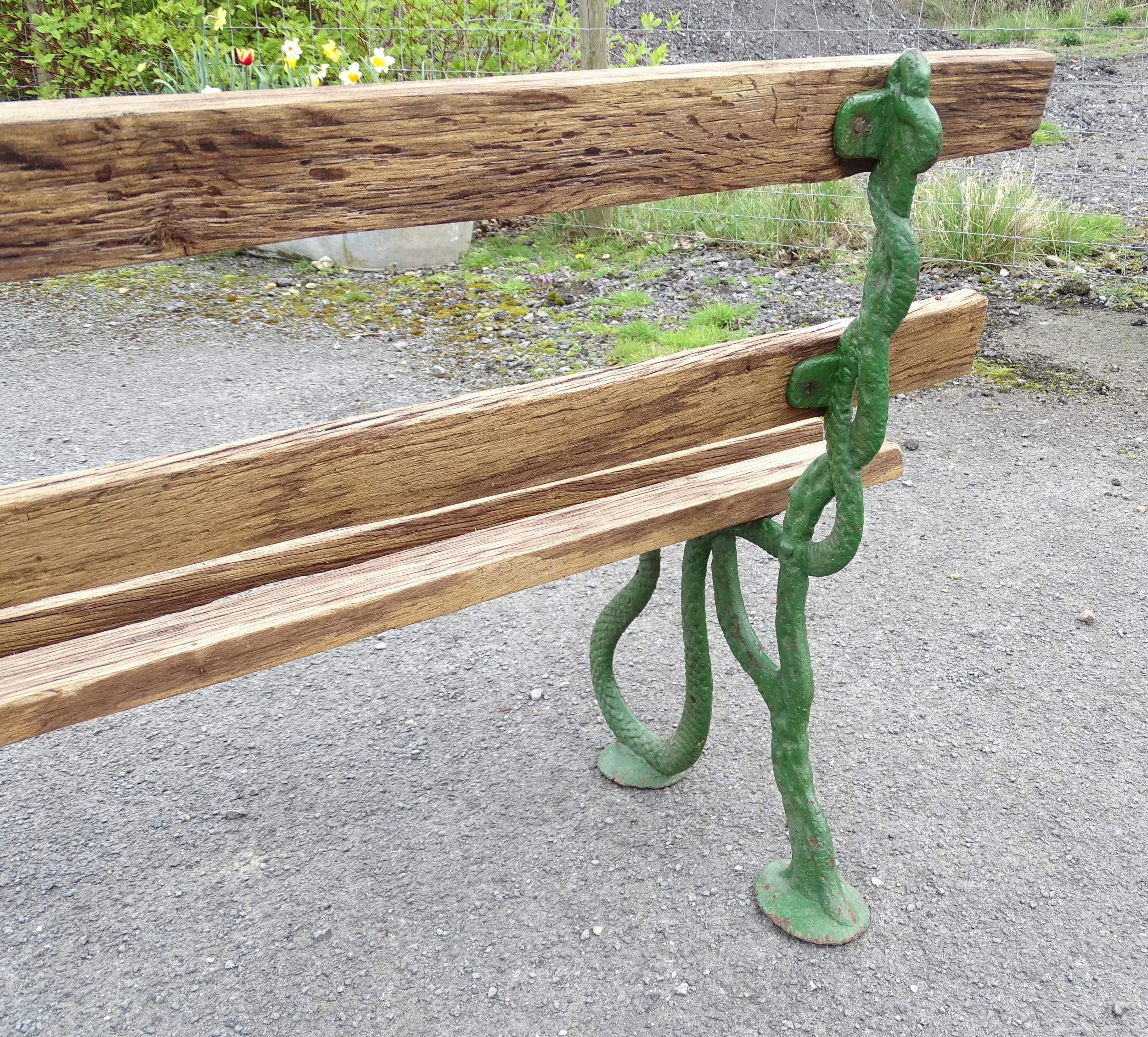 Garden & Architectural : a Coalbrookdale style cast iron and oak slatted garden bench, the - Image 6 of 8