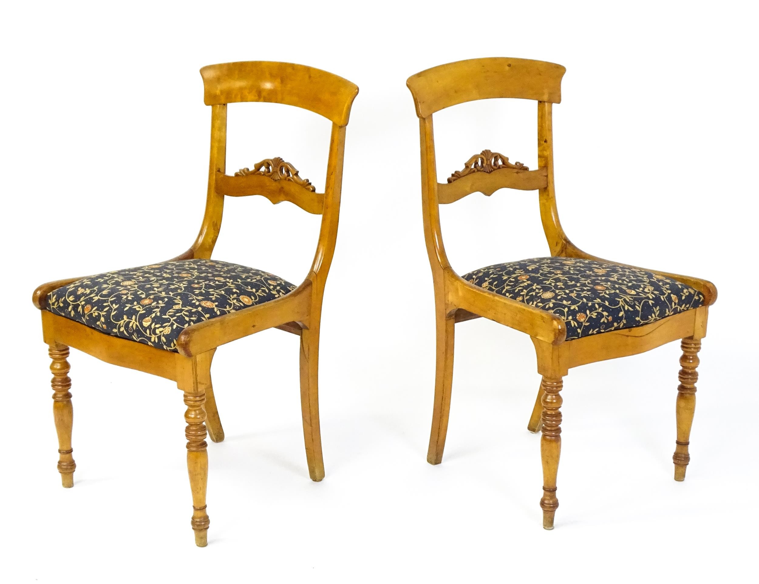 A pair of 19thC side chairs with bowed top rails, carved mid rails, drop in seats and raised on - Image 5 of 6