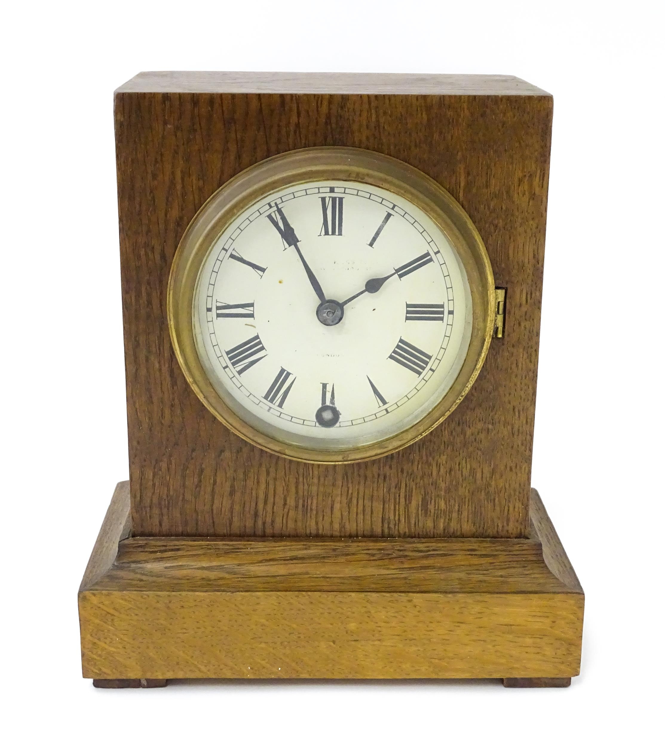 A 20thC oak cased mantle clock bearing label for Camerer, Kuss & Co. Approx. 9 1/4" high Please Note