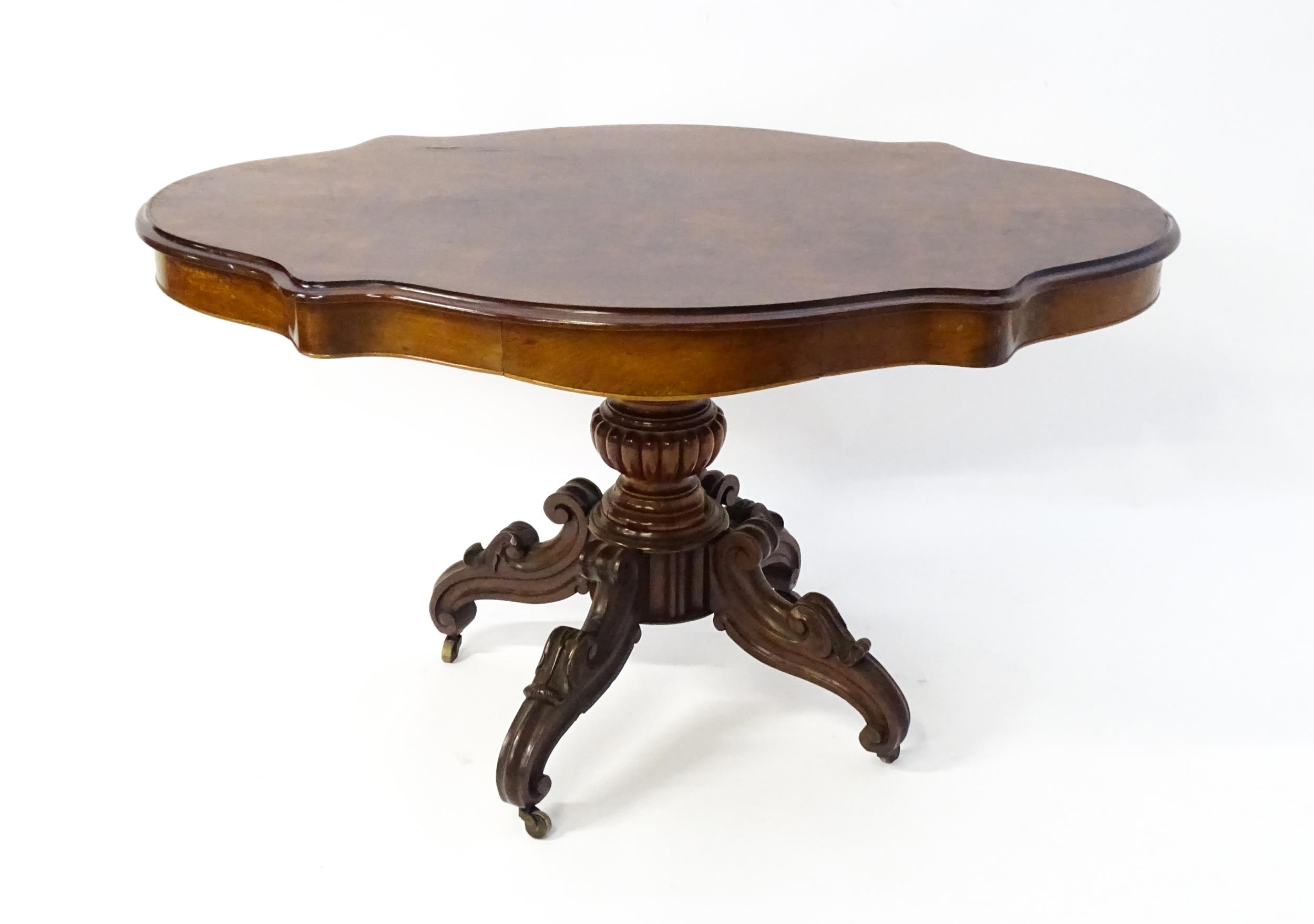 A 19thC mahogany centre table with a moulded top having two frieze drawers, the pedestal having - Image 9 of 9