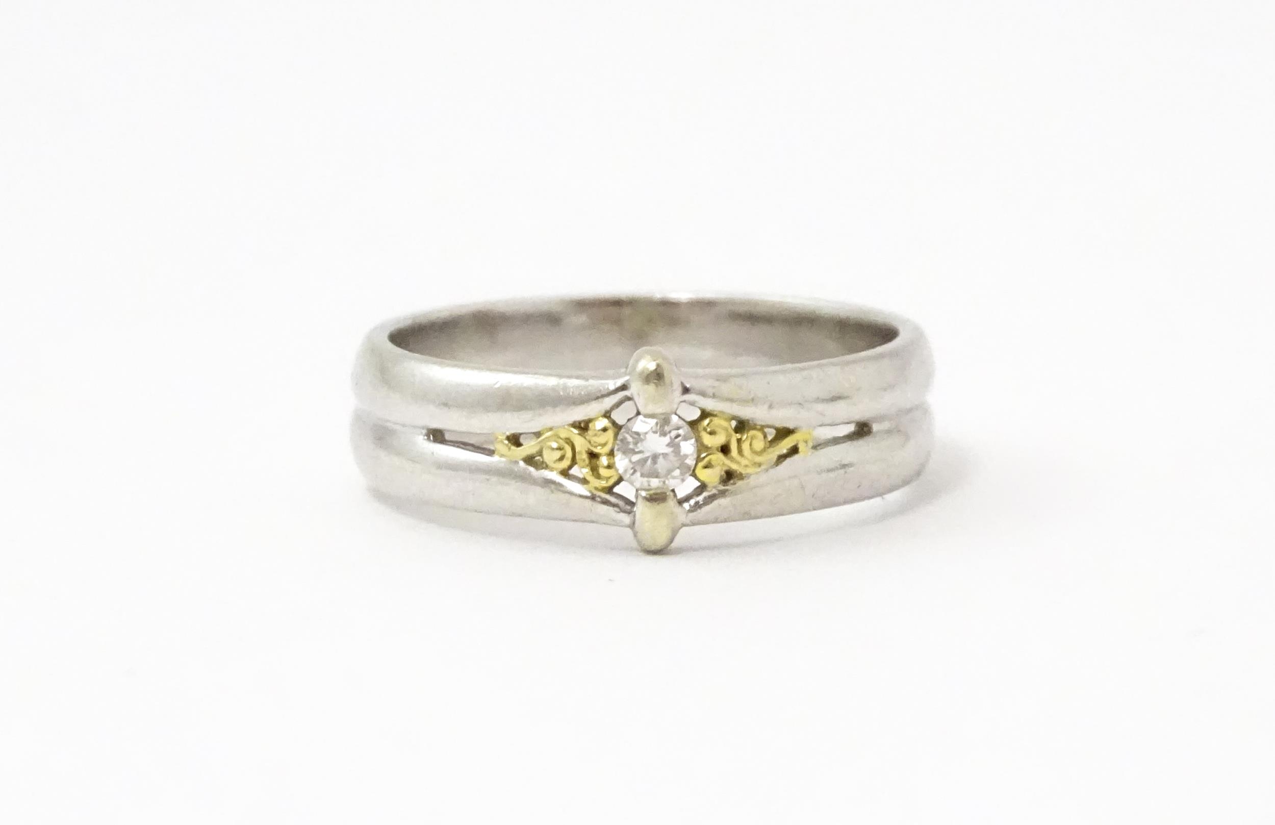 A 9ct white gold ring set with central diamond and gilt detail. Ring size approx. N Please Note - we - Image 3 of 6