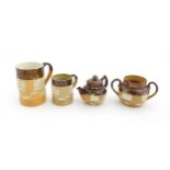 Four Royal Doulton two tone stoneware items with applied hunting detail to include tankards,