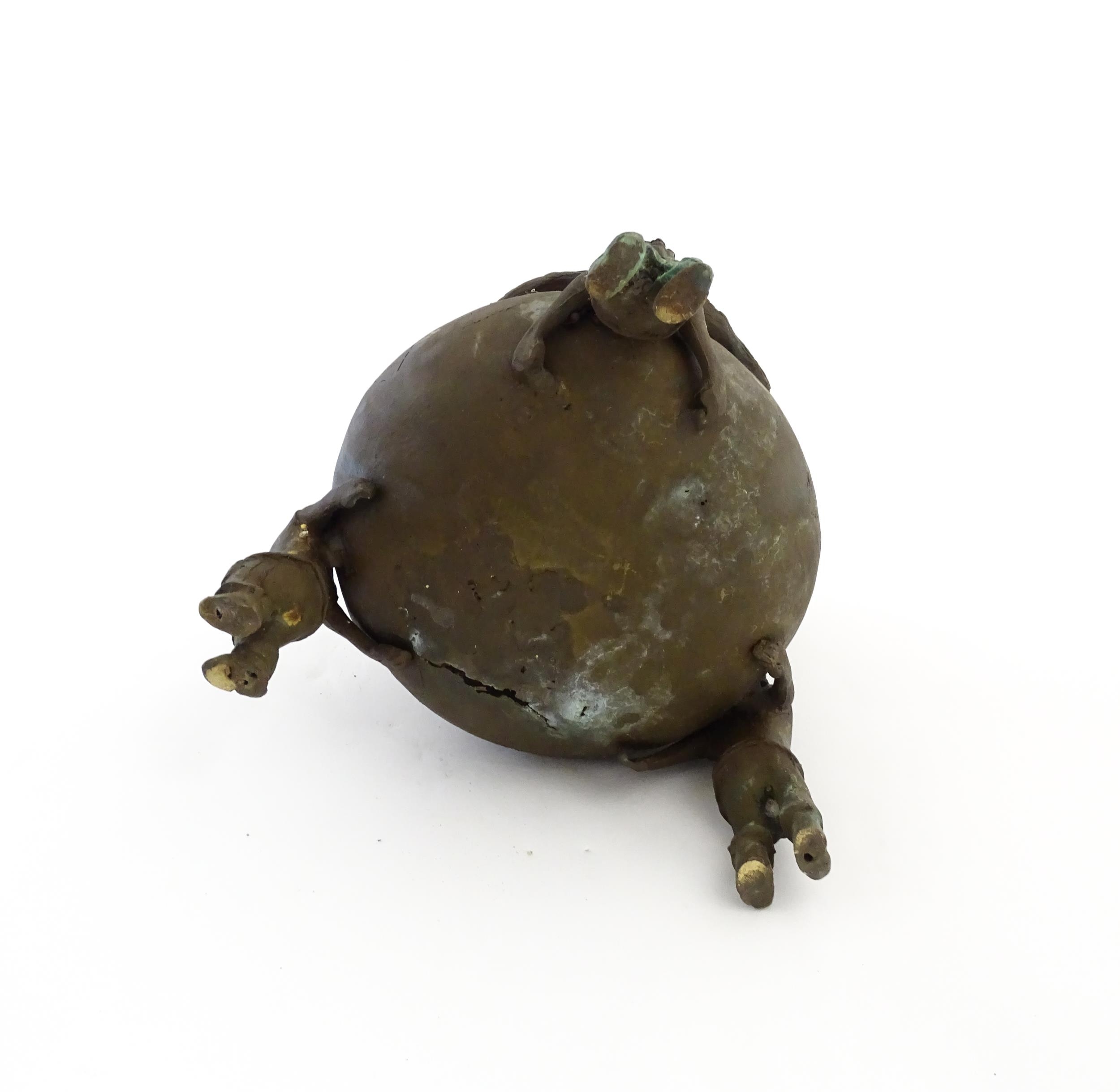 A Chinese cast bronze pot and cover modelled as a money bag with rope tie supported by three figural - Image 2 of 10