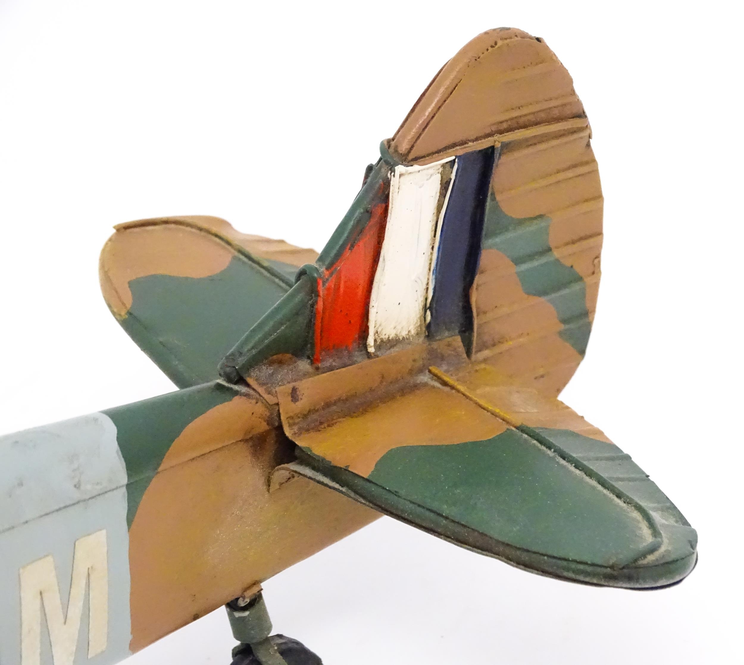 A 20thC scratch built tin plate scale model of a spitfire. Approx. 18" wide Please Note - we do - Image 8 of 10