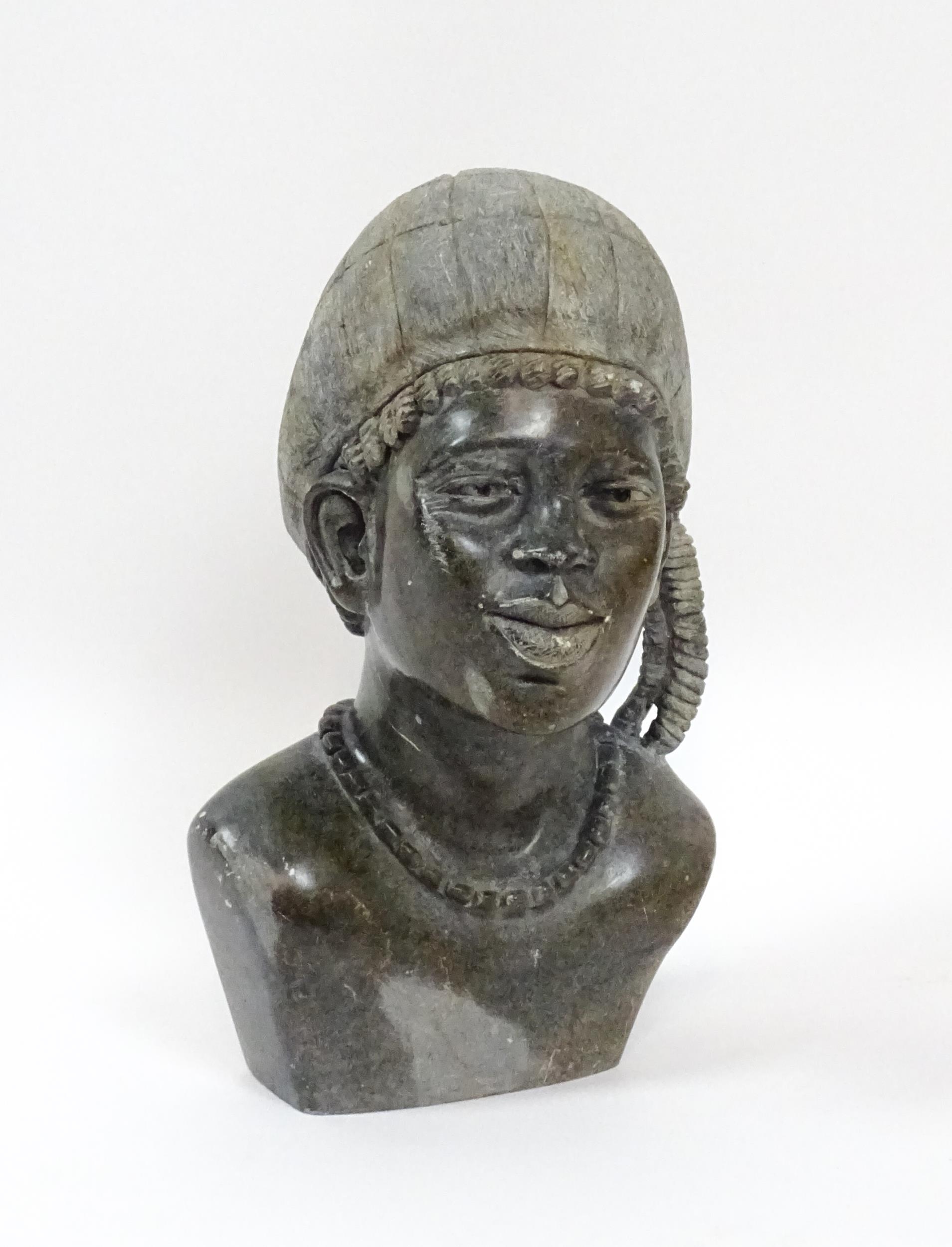 Ethnographic / Native / Tribal : An African carved soapstone bust modelled as a woman wearing a