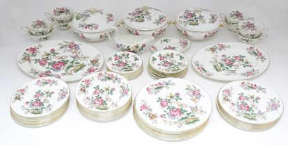 A quantity of Wedgwood dinner wares in the Charnwood pattern to include plates, twin handles soup