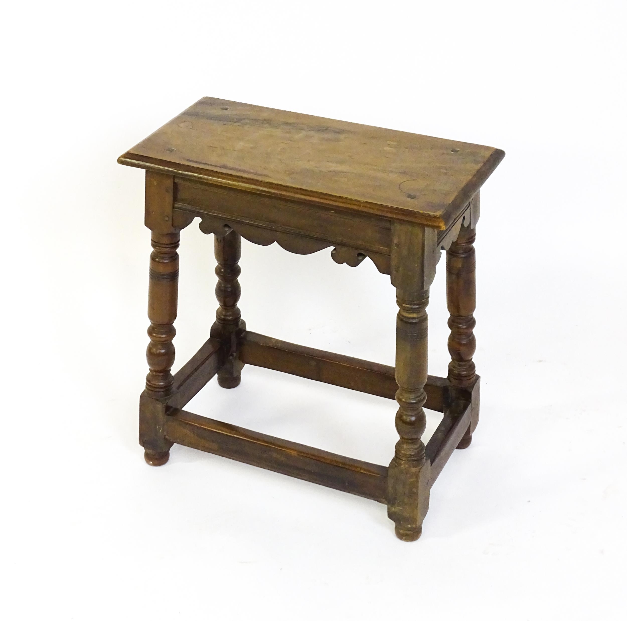 A 19thC walnut join stool of peg jointed construction, with a rectangular top above a moulded - Image 5 of 6