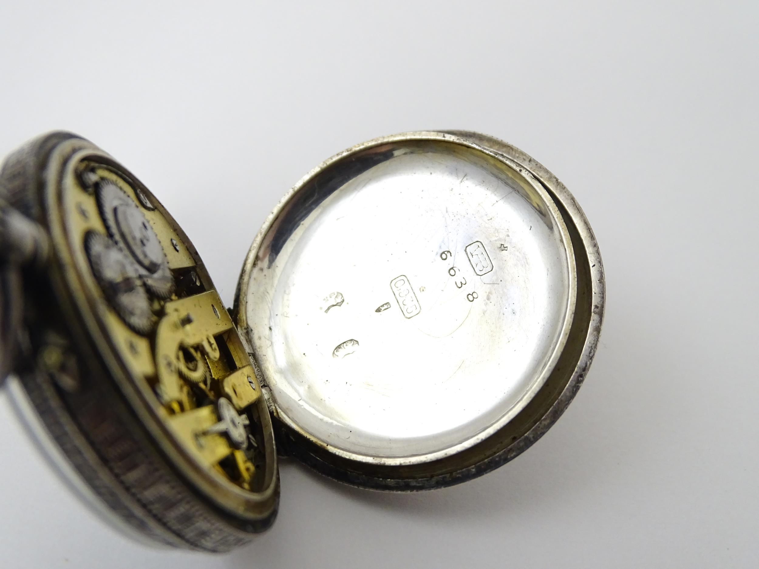 A Swiss silver cased pocket / fob watch with enamel detail and Roman Numerals. Approx 1 /4" wide - Image 10 of 11