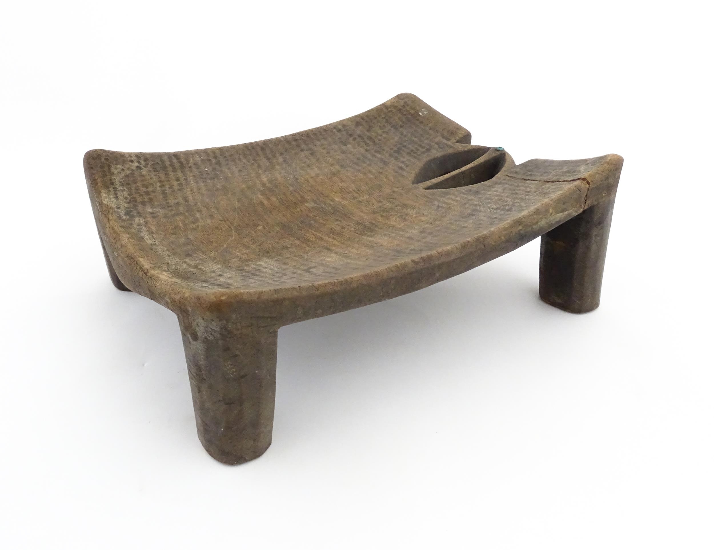 Ethnographic / Native / Tribal: An African carved wooden stool with pierced decoration, raised on - Image 3 of 7