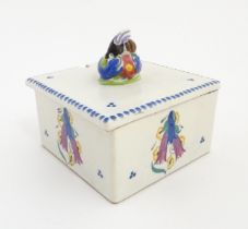 A Poole Pottery honeycomb box and cover with bee finial. Marked under. Approx. 4 1/2" high x 5" wide