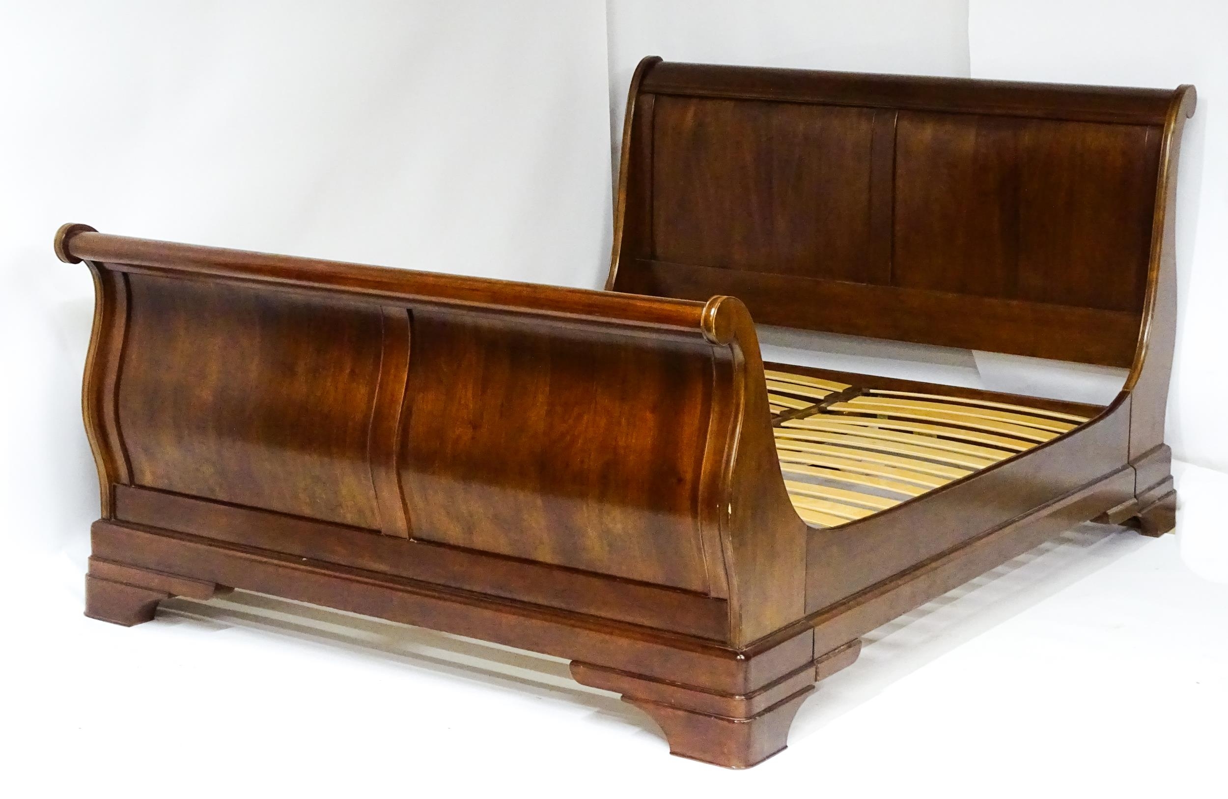 A modern mahogany sleigh bed. 6 1/2ft long x 5ft wide. Please Note - we do not make reference to the - Image 2 of 6