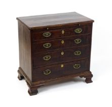 A George III mahogany bachelors chest of drawers, the moulded top having re-entrant corners above
