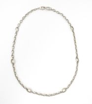 A 9ct white gold and white metal necklace. Approx. 22" long Please Note - we do not make reference