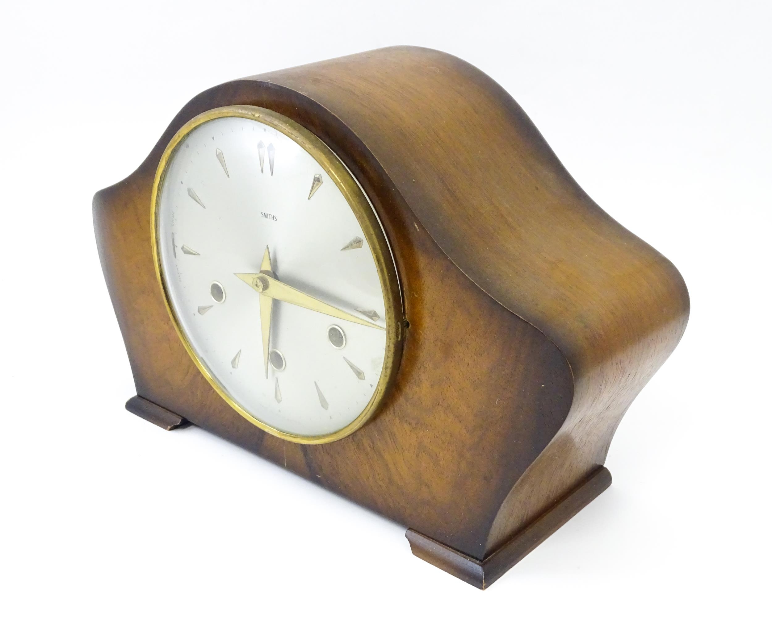A 20thC smiths walnut cased mantle clock with chiming movement. Approx. 8" high Please Note - we - Image 4 of 9