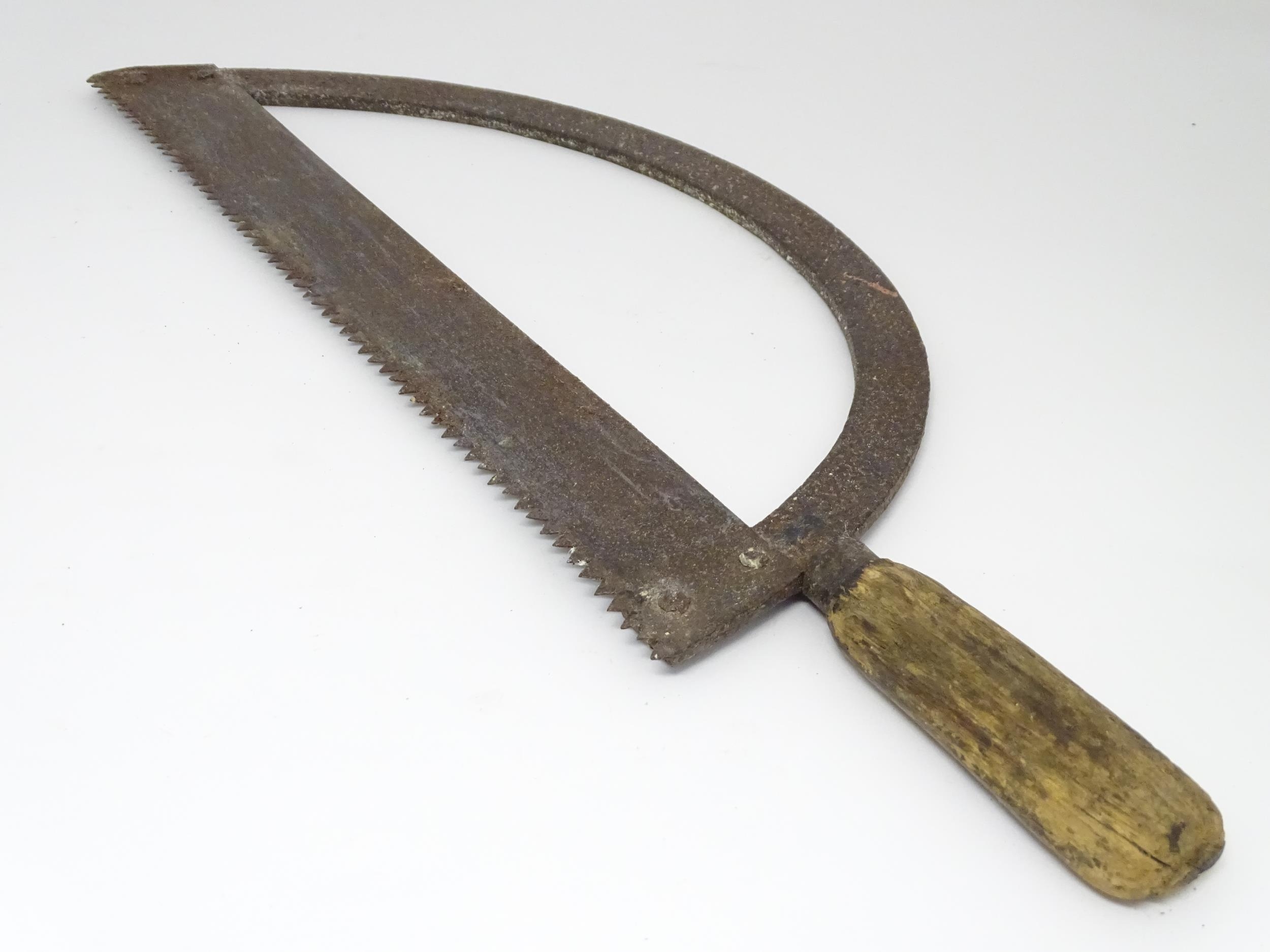 A 19thC bow saw , with arc frame and wooden handle, approx 23" long Please Note - we do not make - Image 5 of 6