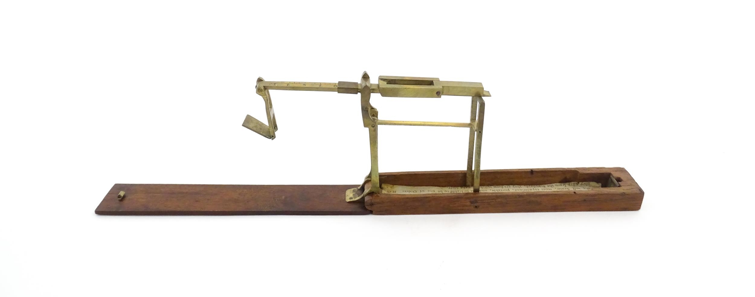 A 19thC mahogany cased brass folding guinea / coin scale. Case approx. 5 1/2" long Please Note - - Image 5 of 11