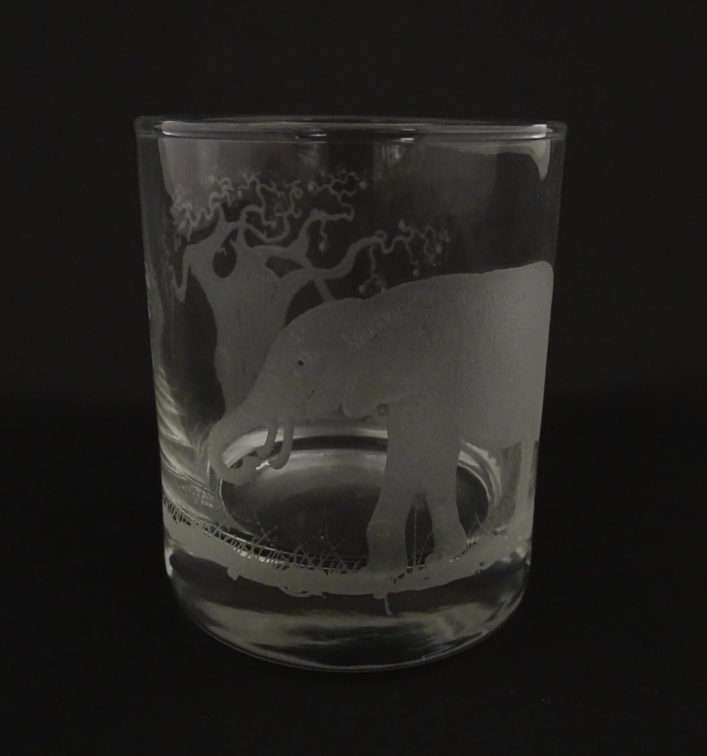 A Rowland Ward decanter glass with engraved Safari animal detail. Unsigned. Together with a similar - Image 10 of 11