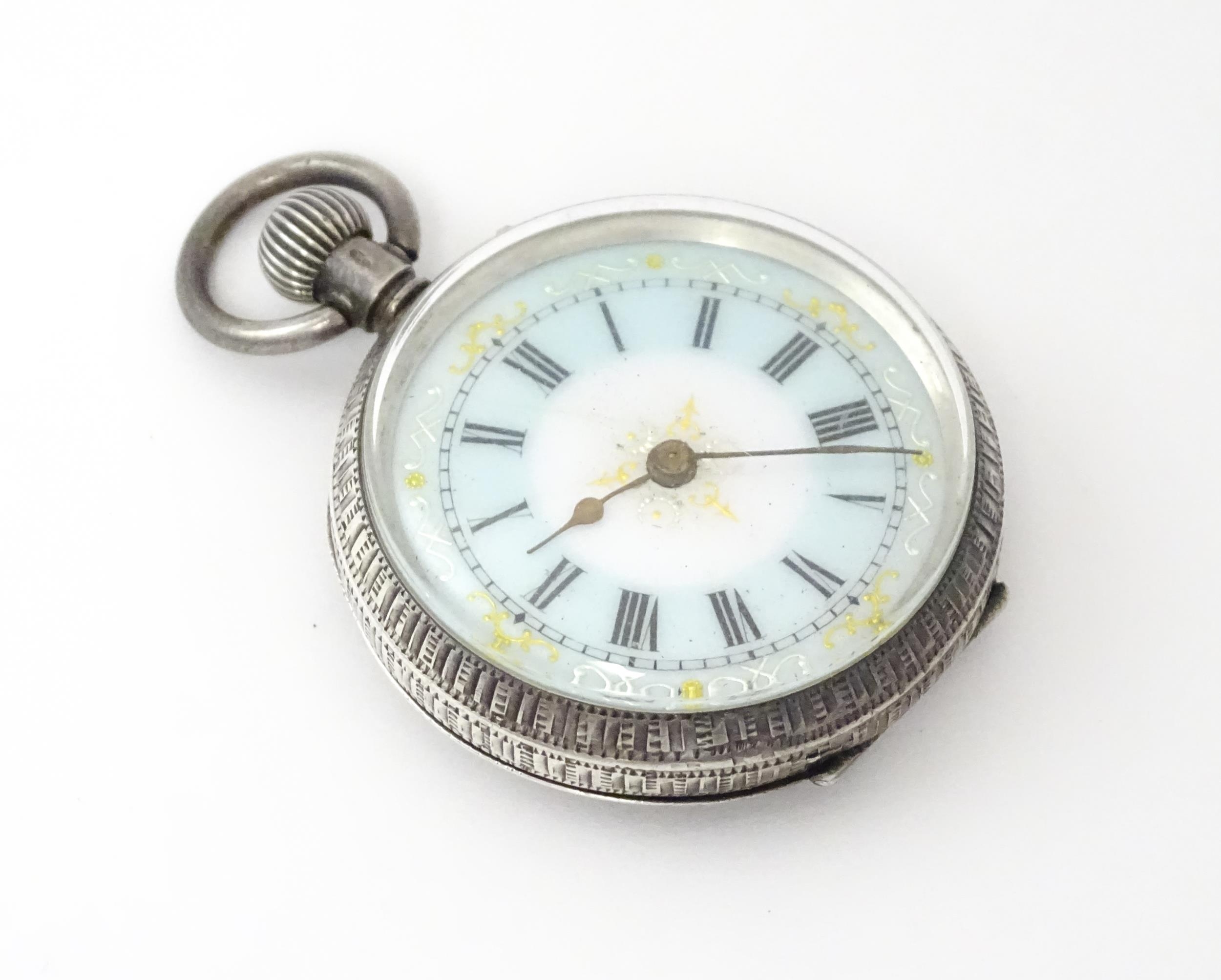 A Swiss silver cased pocket / fob watch with enamel detail and Roman Numerals. Approx 1 /4" wide - Image 4 of 11