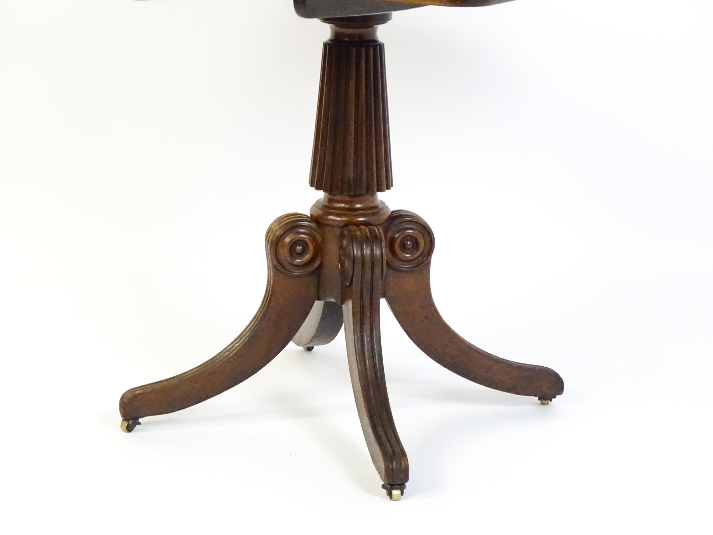 A 19thC mahogany occasional table, with a reeded tapering pedestal and raised on four reeded legs - Image 7 of 8