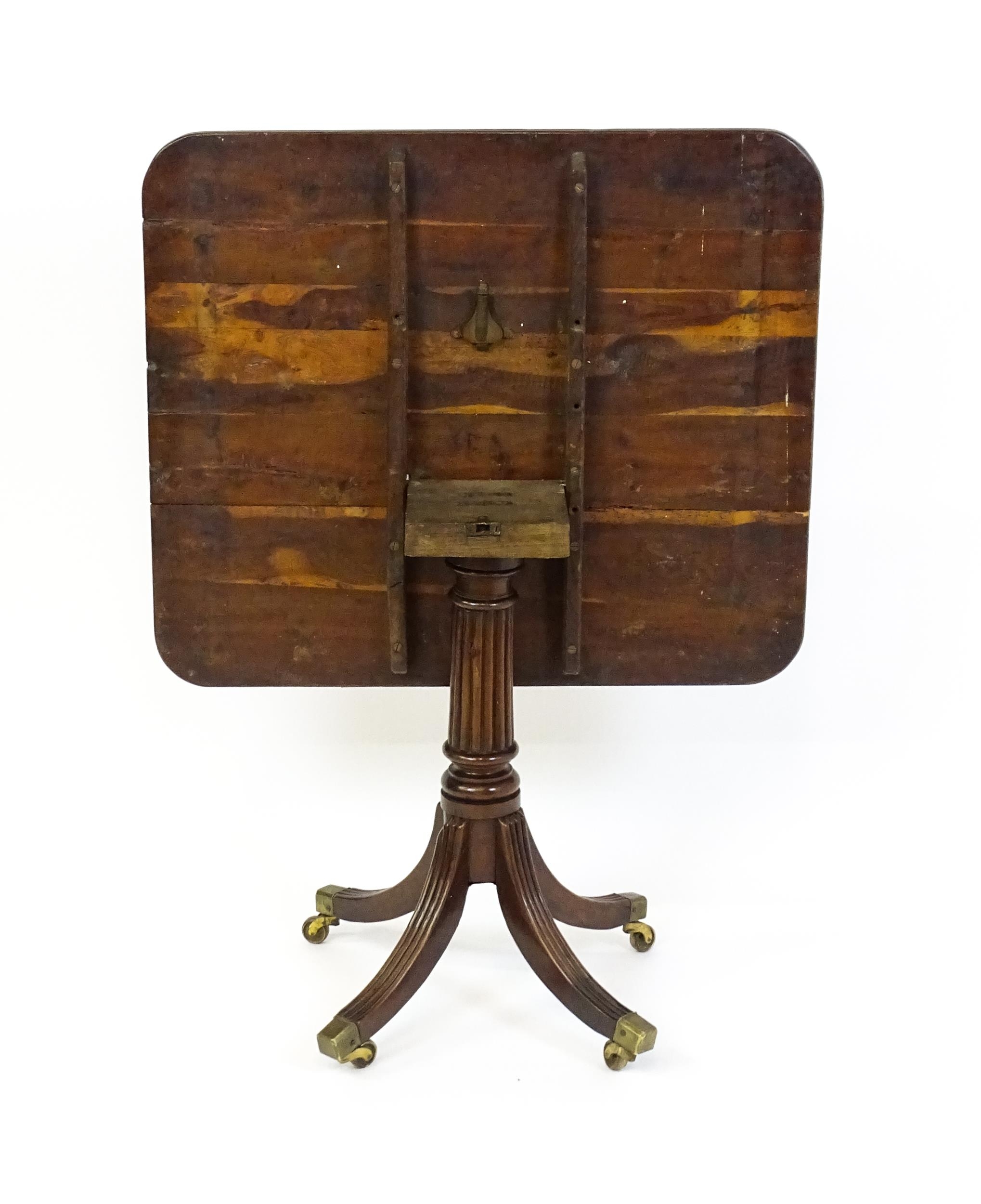 A 19thC tilt top occasional table with yew wood planked top above a reeded mahogany pedestal and - Image 2 of 13