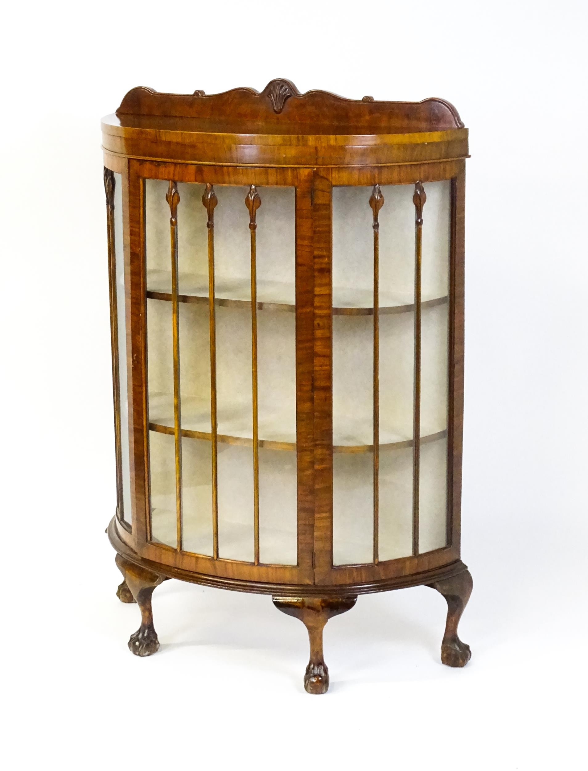 An early / mid 20thC walnut demi lune display cabinet with a shaped and carved upstand above a - Image 8 of 8