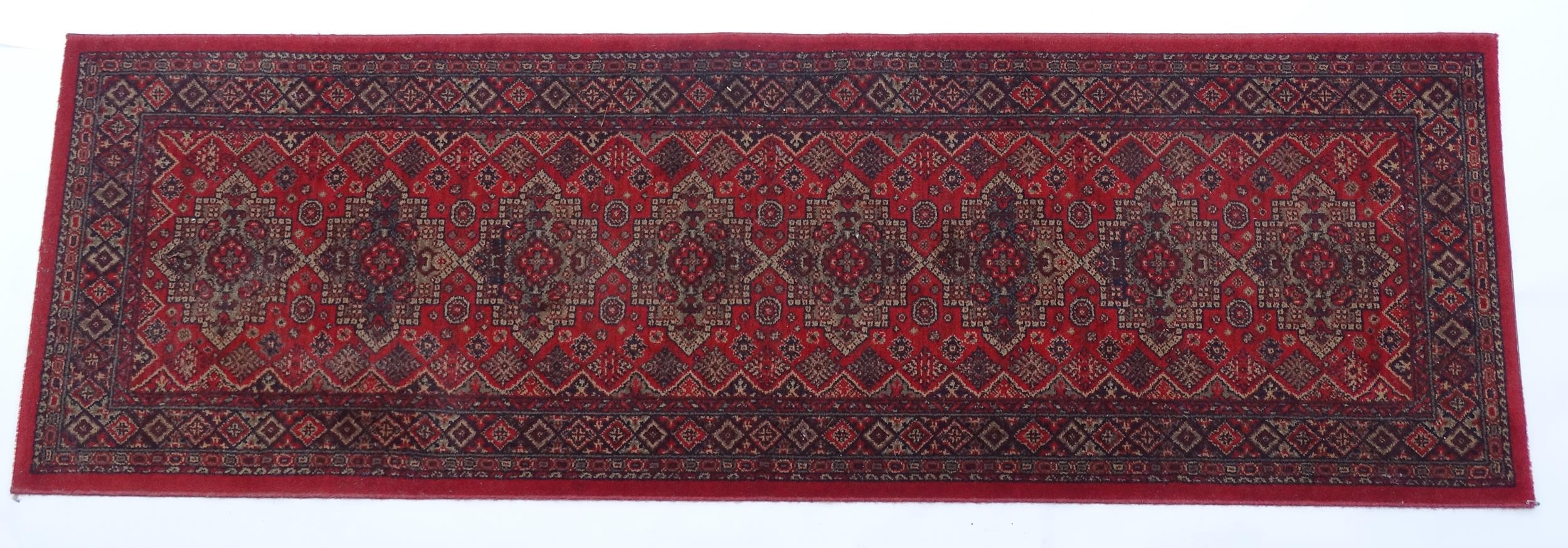 Carpet / Rug : A red ground runner with repeating motifs to centre, bordered by geometric banding. - Image 3 of 8