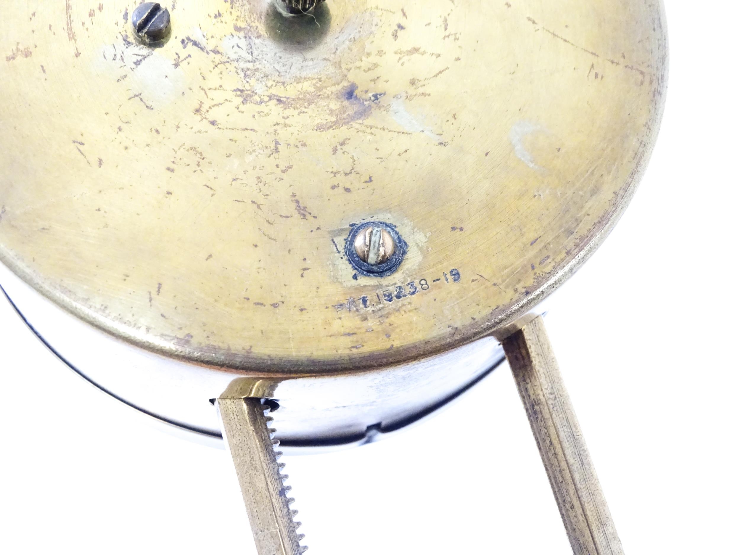 A brass cased Gravity clock with dial with Arabic numerals and having exposed escapement. Marked - Image 7 of 9