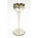A silver bud vase hallmarked Birmingham 1904. Approx. 7 1/2" high Please Note - we do not make