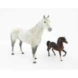 A large Beswick dapple grey hunter horse. Together with a Beswick brown jogging mare. Marked