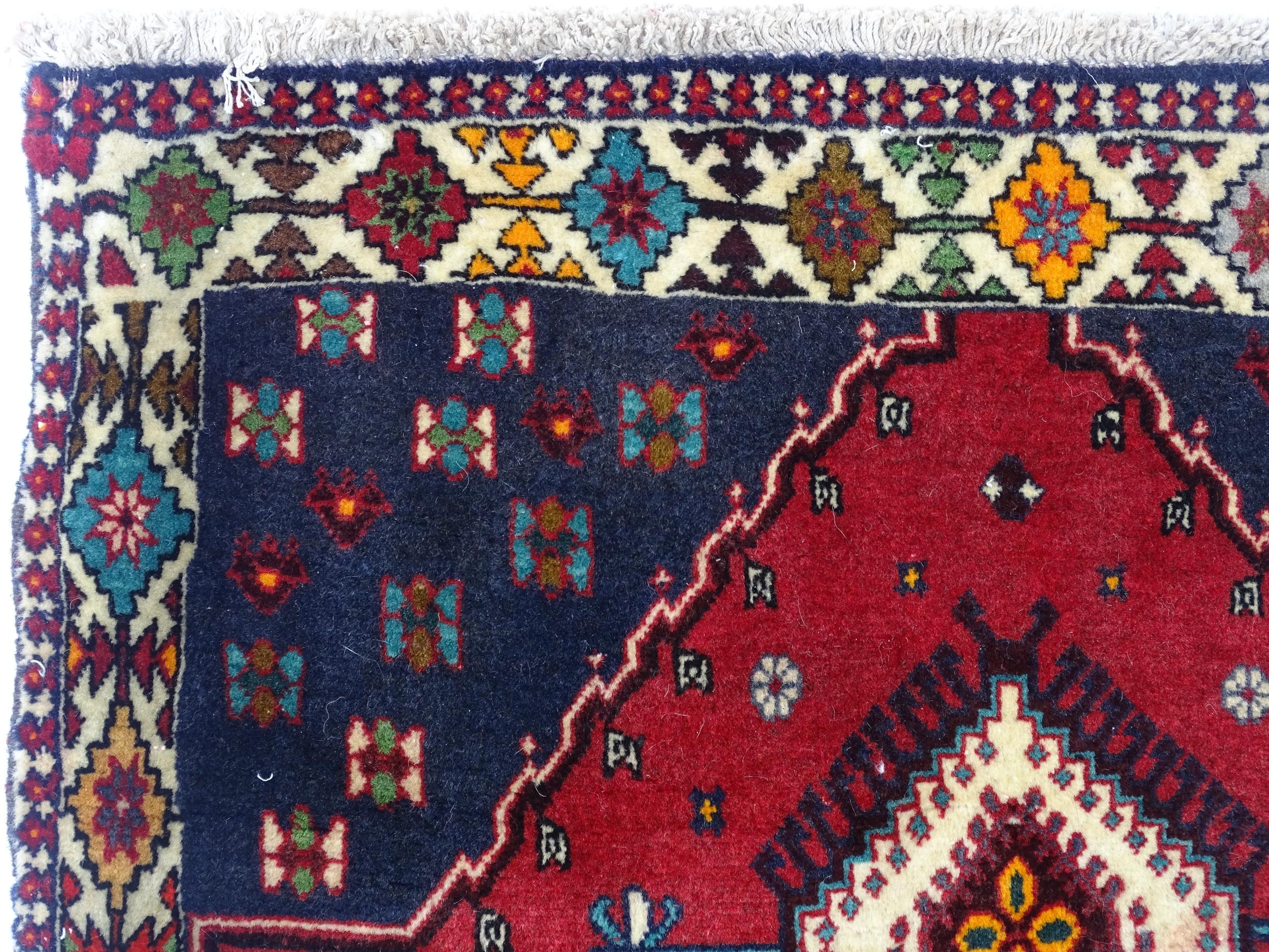 Carpet / Rug: A South West Persian Qashqai rug the red ground decorated with geometric motifs. - Image 4 of 9