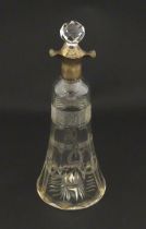 A cut glass decanter with silver mounts hallmarked Birmingham 1911. Approx. 9 1/4" high Please