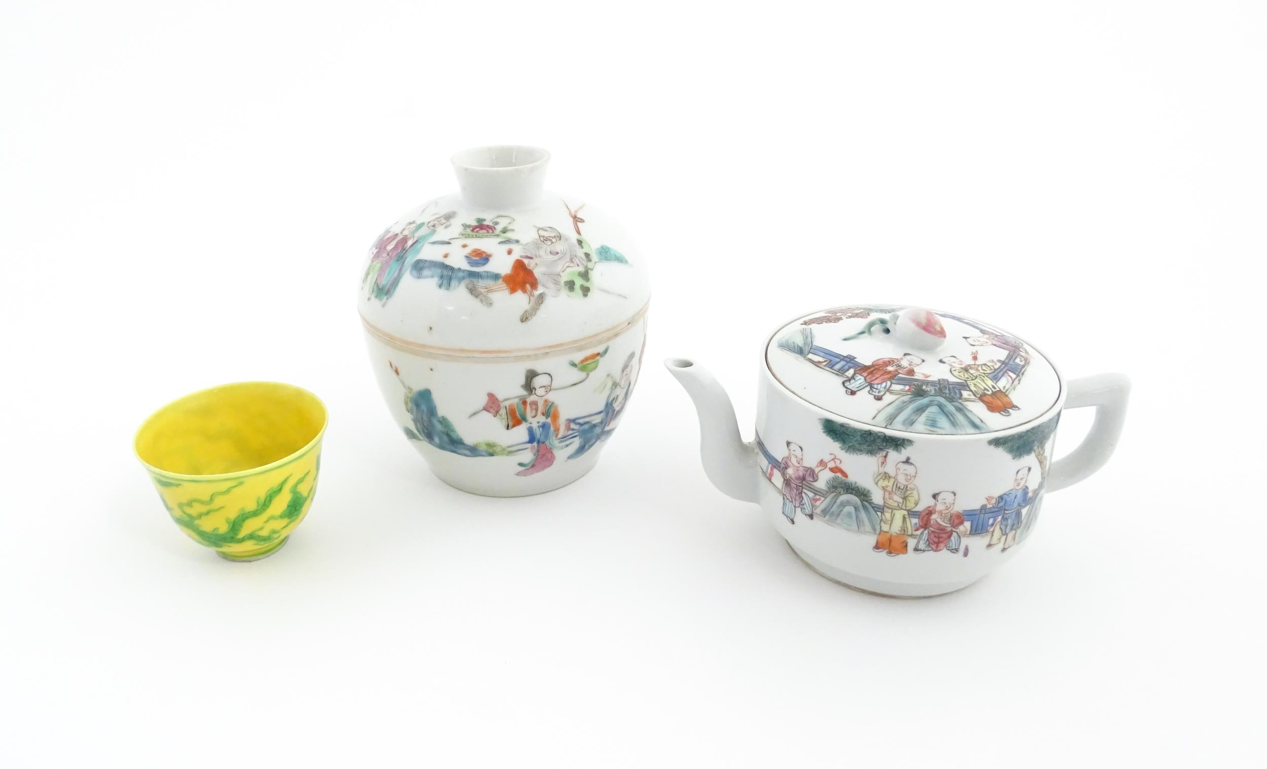 Three Chinese items comprising a famille rose pot and cover decorated with figures, a teapot