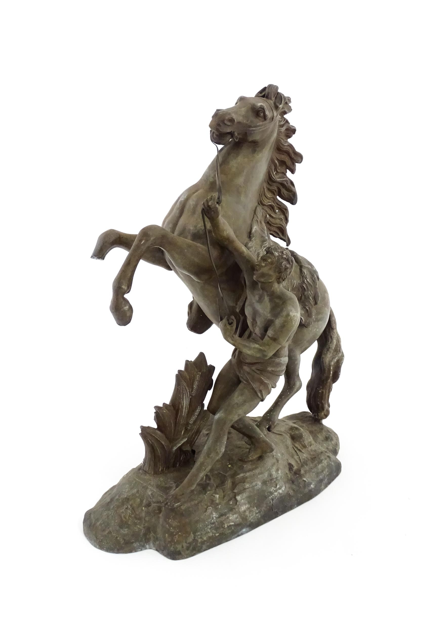 A 20thC cast Marly Horse modelled as a rearing horse with male attendant, after Guillaume Coustou I. - Image 3 of 8