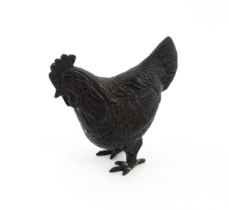 A 20thC cast model of a cockerel / rooster with feather detail. Approx. 4 3/4" high Please Note - we