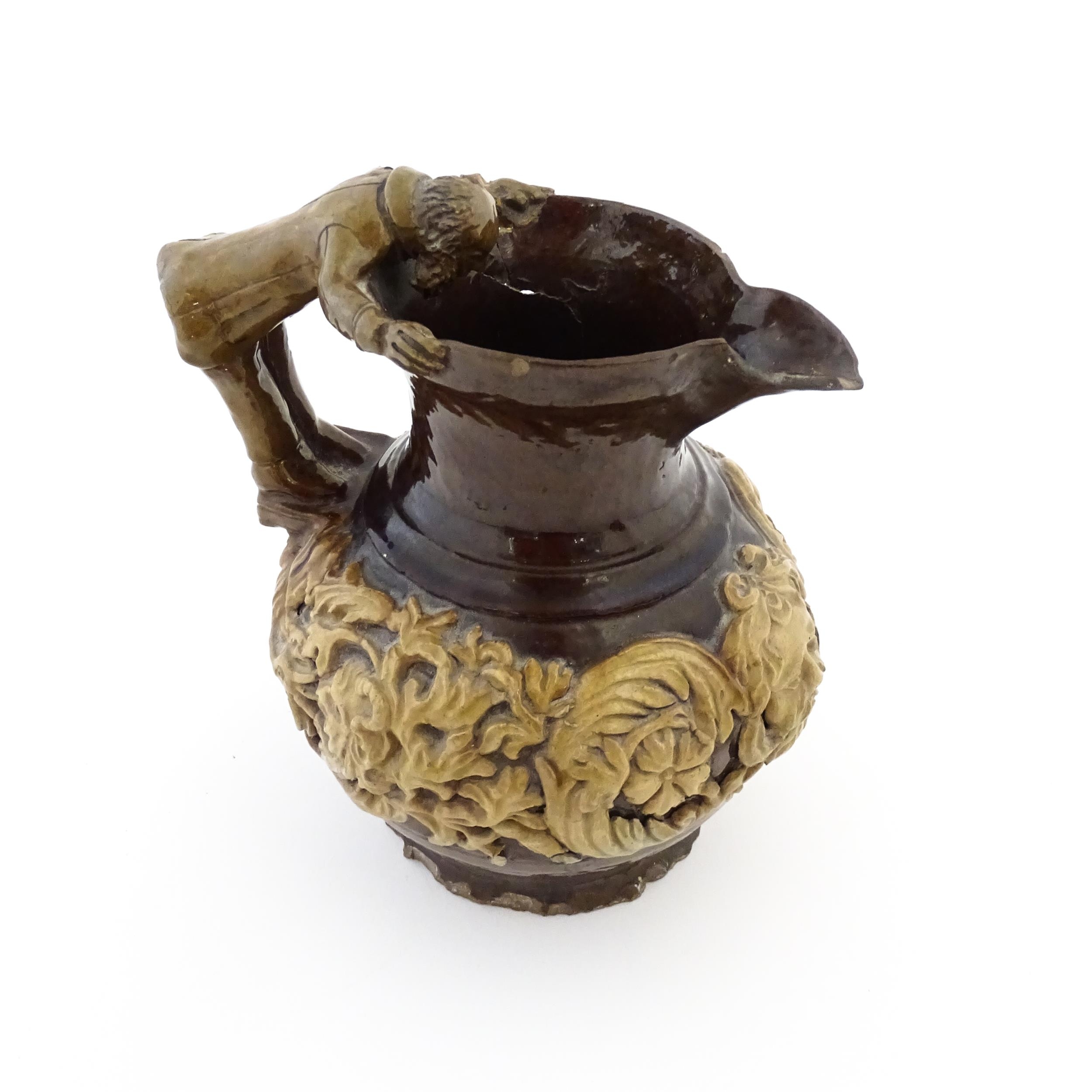 A 19th century Castle Hedingham treacle glazed jug by Edward Bingham with banded relief foliate - Image 4 of 7