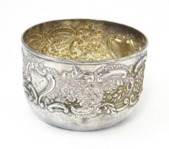 A Victorian silver bowl with embossed floral and scroll decoration hallmarked Birmingham 1898, maker